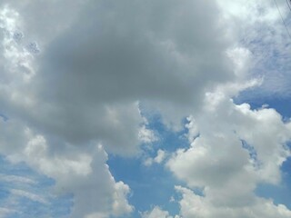 Blue skies and clouds backgrounds and textures closeup for wallpaper interior design. In Nakhon Pathom, Thailand.