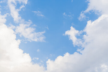 Fototapeta premium Beautiful Sky with clouds on sunny summer day. Abstract background with copyspace. Reference image for digital painting. Stock photo.