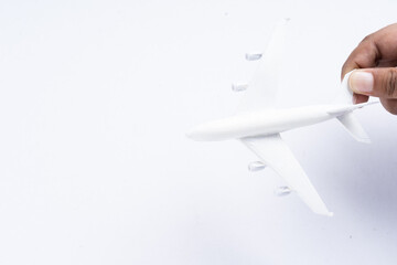 Miniature aeroplane isolated on white