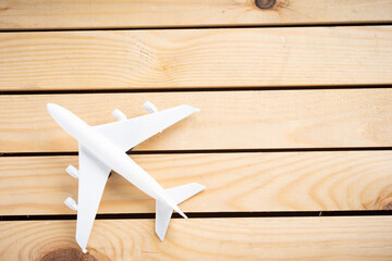Naklejka na ściany i meble Miniature aeroplane on wooden surface