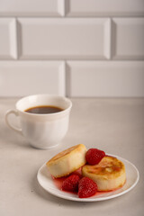 Cheese pancakes with strawberries and fresh morning coffee