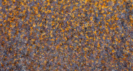 Rust on iron, metal surface brown yellow gamma, bokeh