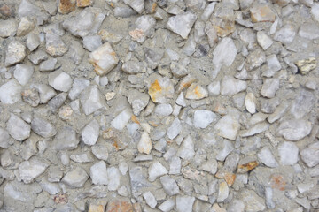 white and gray quartz with orange spots in the concrete