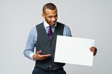 professional african-american business man - presenting holding blank sign