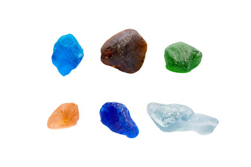 Variety of colorful transparent natural gems or pebble stones isolated on white