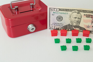 Real estate and mortgage investment concept. Little houses on the white background.