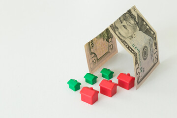 Real estate and mortgage investment concept. Little houses on the white background.