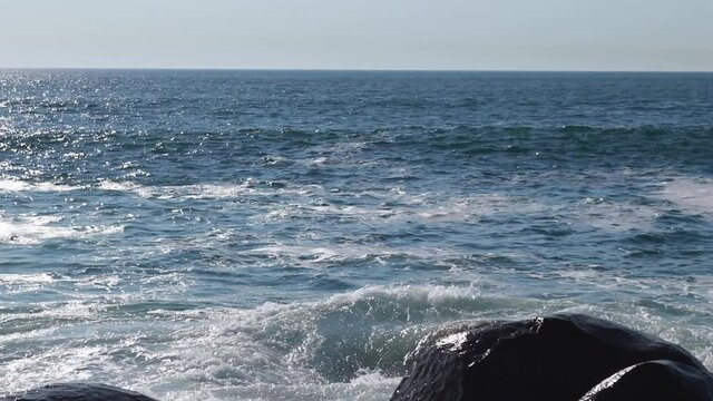 Powerful ocean waves. The coast of the Atlantic Ocean.
Static camera. Close-up of waves breaking on coastal stones.