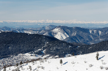 Panoramic winter landscape of the Caucasus mountains.
Beautiful panoramic view of the slopes of the mountains. View from the top of the mountain to the Caucasian ridge.