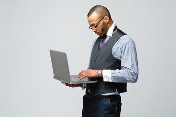 professional african-american business man holding laptop computer