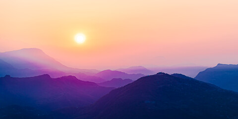 Beautiful landscape with mointains and rising sun. Sunrise at Sarangkot village, above Pokhara city, Nepal, Himalayas