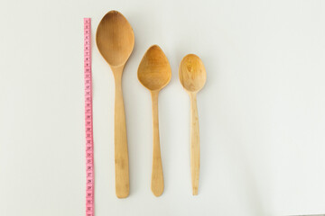 wooden spoon on the blue background.