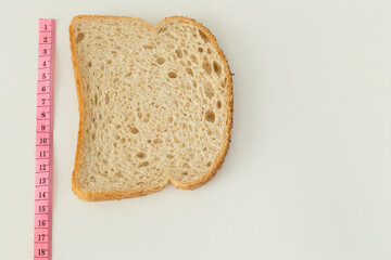 Measure diet healthy bread on the white background.