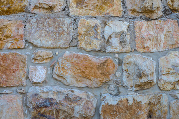 An ancient wall made of rough stones.