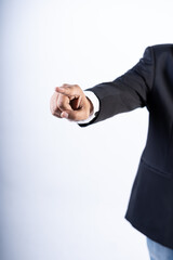 Closed up shot of an asian men pointing at the camera wearing a suit