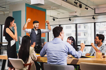 business team celebrate together in office, teamwork success win strategie meeting table