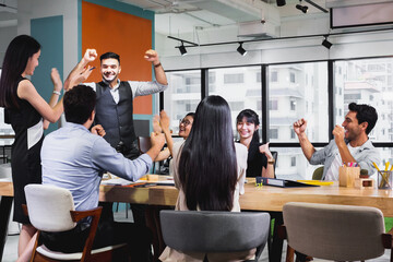 business team celebrate together in office, teamwork success win strategie meeting table