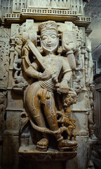 white marble God sculpture on a column in a temple, India