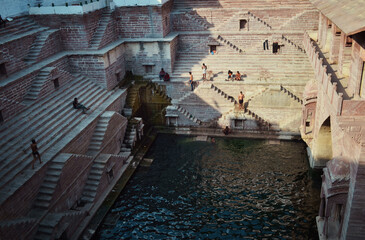 Indian stepwell with green water