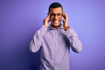 Handsome african american man wearing striped shirt and glasses over purple background with hand on headache because stress. Suffering migraine.