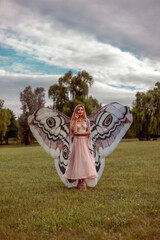 Beautiful woman with big butterfly wings