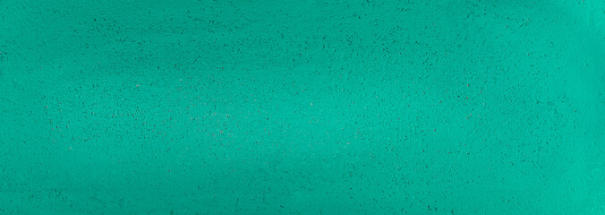 Fototapeta na wymiar Turquoise painted wall texture. Panoramic turquoise wall background