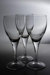 empty wine glasses against a white background