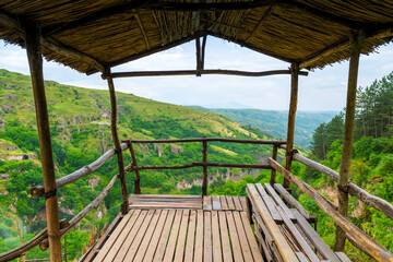 Fototapeta na wymiar Wooden observation deck over the gorge in the picturesque mountains of Armenia