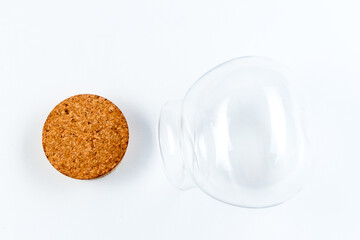 Clear glass bottle with cap isolated on white background, zero waste concept
