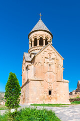 Fototapeta na wymiar Temple with the bell tower of Noravank Monastery on a sunny summer day, a tourist attraction of Armenia