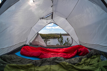 Tent in the forest on a hill