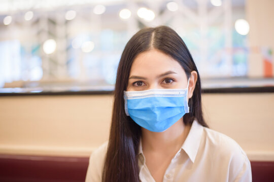 Woman Is Eating In Restaurant With Social Distancing Protocol While Lockdown City Due To  Coronavirus Pandemic