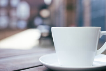 Coffee cup and saucer with negative space