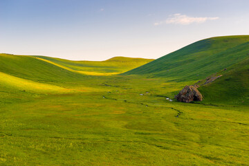 beautiful landscape on a sunny day, smooth green beautiful valley of the mountains of Armenia in June