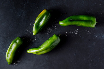 Green pepper on black background