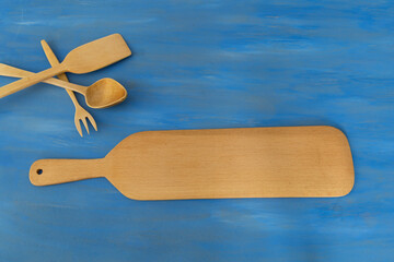 wooden spoon on the blue background.