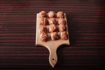 meat balls on old wooden board stock photo
