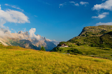 Obraz premium Very beautiful view of the evening mountains Pale di San Martino village with Dolomite peaks in Val di Primiero Noana of Trentino Alto-Adige