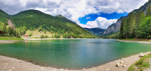 Lake Montriond in French Alps, in Haute Savoie. Summer  mountain landscape, travel and tourism concept