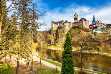 Amazing landmark in Czech Republic, near Karlovy Vary Loket middleaged castle with blue sky in...