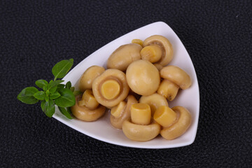 Pickled champignon heap in the bowl