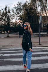 Fototapeta premium Photo session of a stylish girl outdoors. Walk in your hometown. 