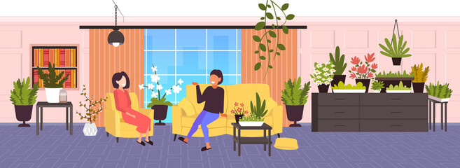 girls discussing during meeting women relaxing in modern living room with house plants green indoor horizontal full length vector illustration