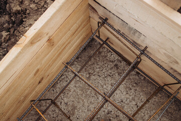 The foundation for the house, a wooden box with fittings inserted in the middle