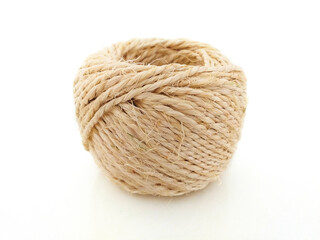 Obraz premium High quality handmade natural hemp rope coil isolated on white background. Rustic beige cord of natural composition respectful with the environment. Jute rope Ecofriendly