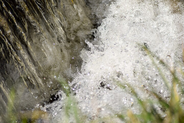 A clean mountain stream, a small waterfall