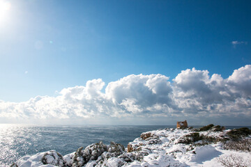 Uluzzo tower after a exceptional snowfall, Salento, Italy