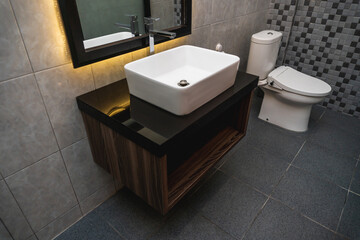 Fototapeta premium white clean sink with the crane and mirror in the bathroom