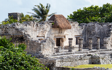 Ancient ruins in the warm tropical sunlight. Situated in the Mayan city of Tulum in Quintana Roo, Mexico.
