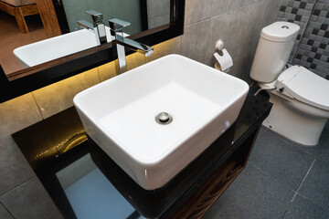 The photo of a sink and mirror in a bathroom